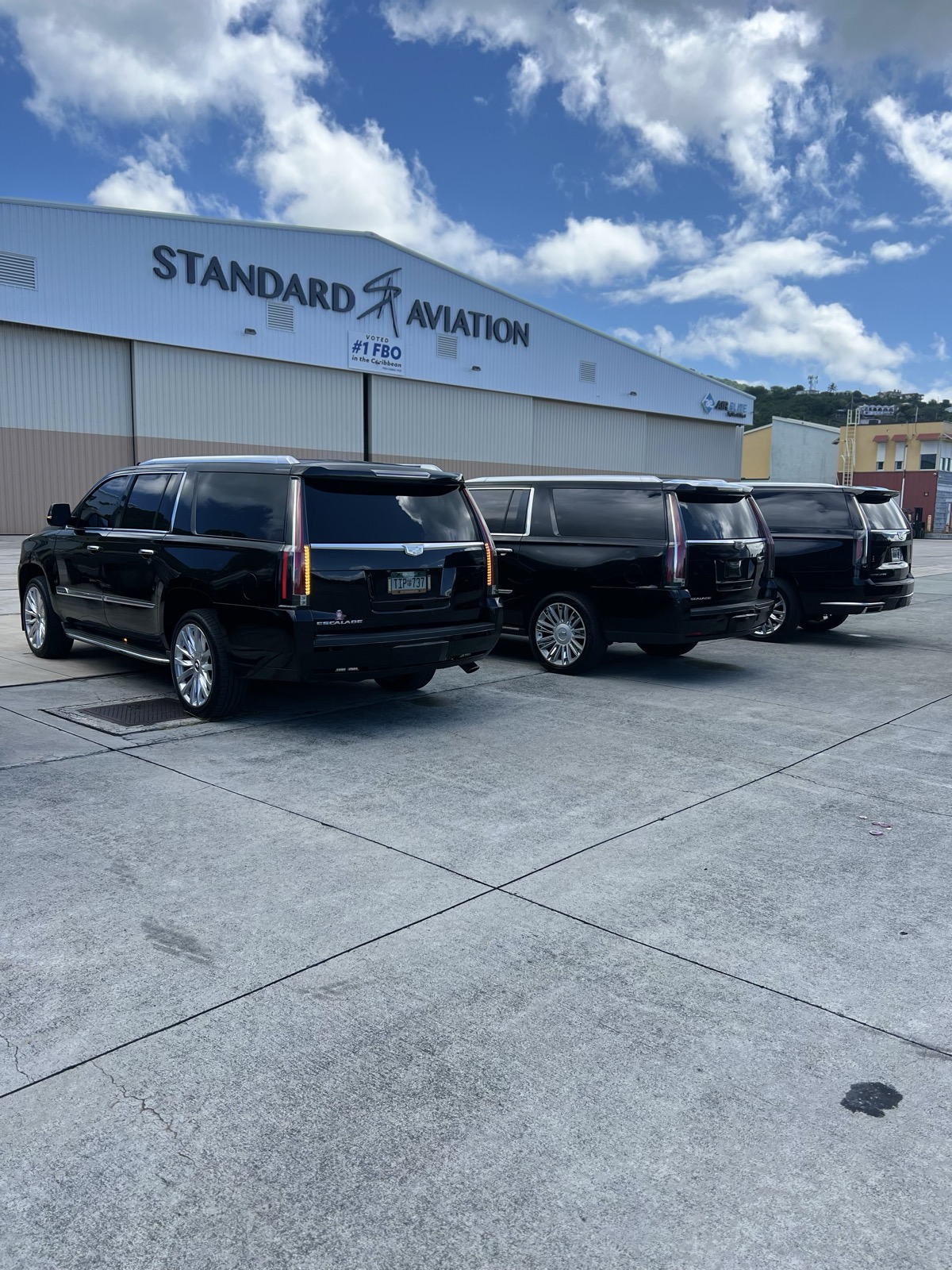 Kojak Limousine fleet of Cadillac Escalades at Cyril E. King Airport