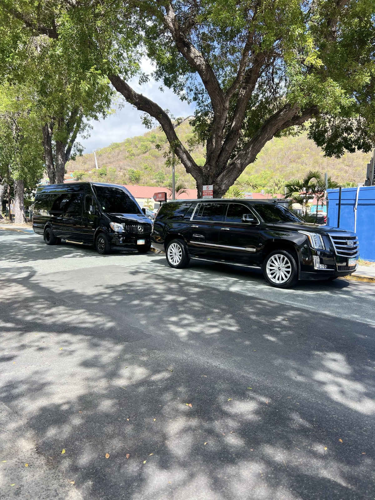Kojak Limousine Mercedes-Benz Sprinter and Cadillac Escalade parked in St. Thomas