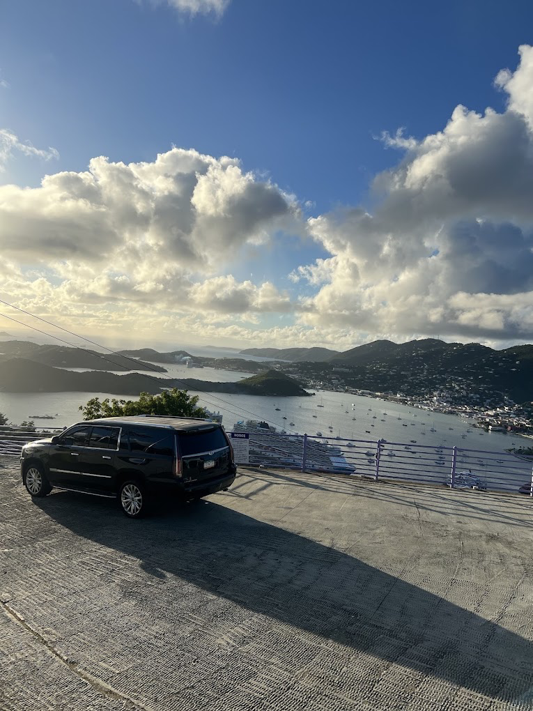 Kojak Limousine Cadillac Escalade overlooking Charlotte Amalie harbor at sunset